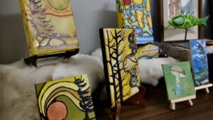 Leanne Nicholson’s mixed-media art transforms wildlife imagery, bones, and antlers into powerful works at Dyment Recreation Hall.