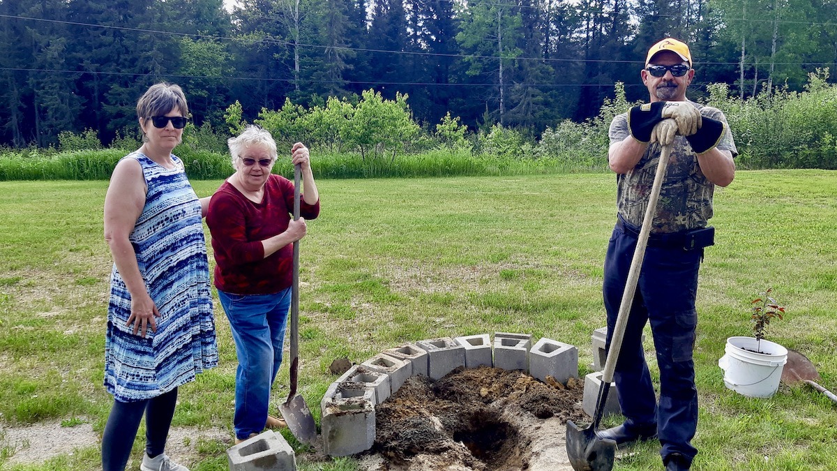 Leanne Nicholson, Terri Bell, and Pat Daignault spent the afternoon at Dyment Recreation Hall Park in Melgund Township, Northwestern Ontario, taking part in a hands-on community effort to strengthen local recreation space through garden development and tree planting.