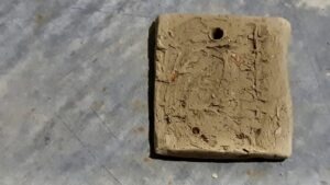 This test tile, stamped with birch bark, will become a simple pendant made from wild clay harvested this summery with Art Borups Corners.