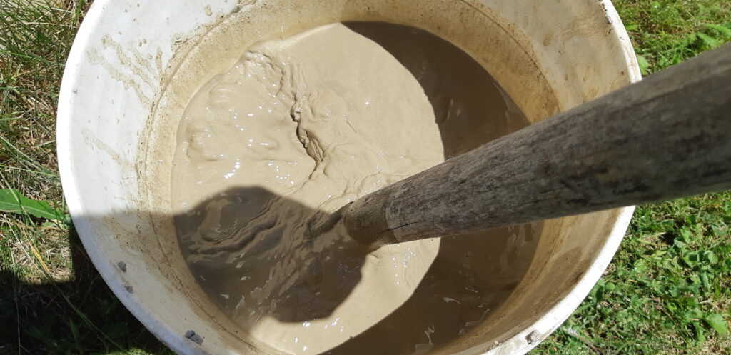 The second step is to take the clay chunks and break them down in a five-gallon bucket. This process is called slaking!