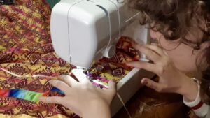 Hands, fabric and a little patience! This week, youth are learning the craft of sewing while creating ribbon skirts with their own style and creativity.