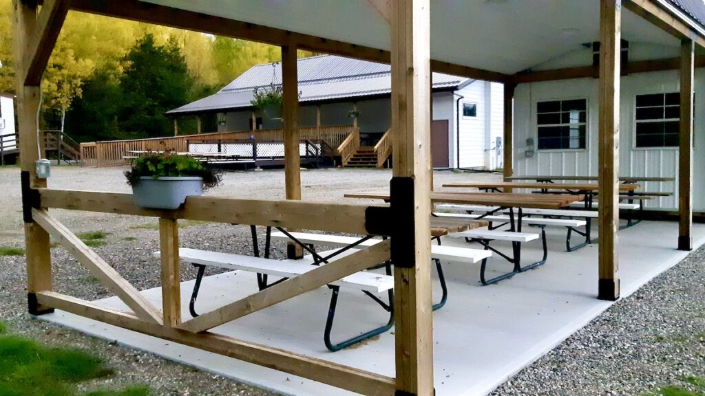 The outdoor grounds are transitioning smoothly into autumn, paving the way for upcoming concrete work and community garden infrastructure.